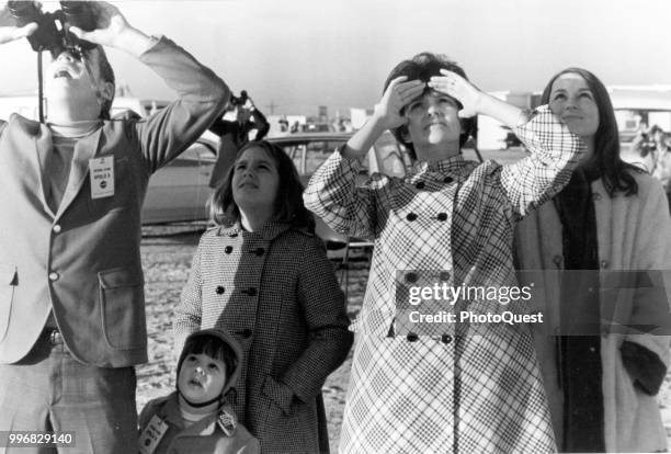 View of Marilyn Lovell , along with her children, as they watch the liftoff of a Saturn V rocket that carries her husband on the Apollo 8 mission at...