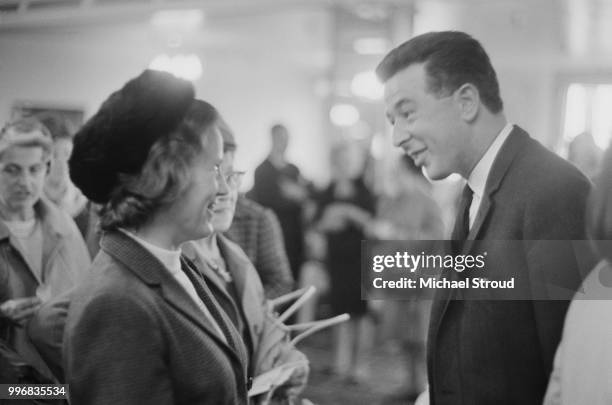 Sir Hugh Fraser, 2nd Baronet , Chairman of the House of Fraser department store group, talks with customers at the company's Barkers store in...