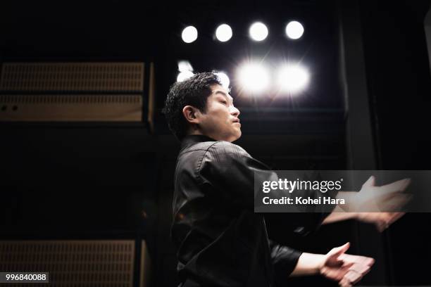 man conducting an orchestra at concert hall - klassisk orkestermusik bildbanksfoton och bilder