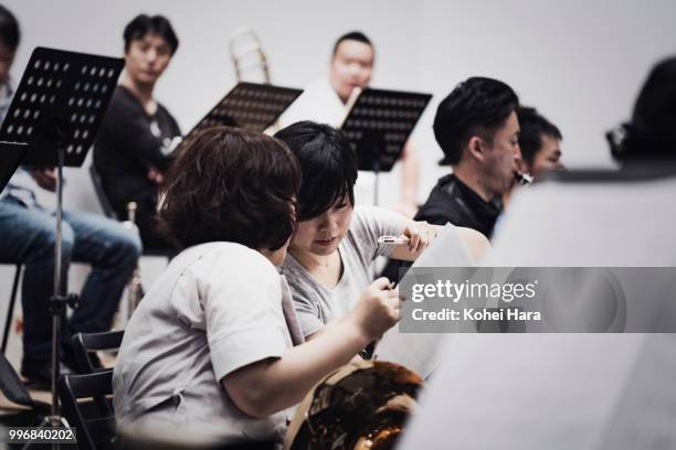 orchestra rehearsing at concert hall - classical orchestral music stock pictures, royalty-free photos & images