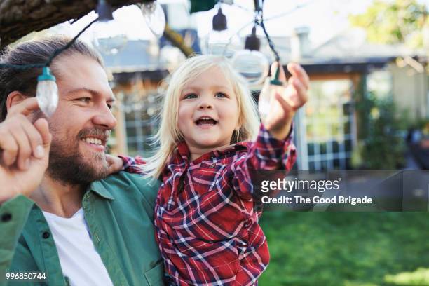 happy father and daughter in backyard - grounds imagens e fotografias de stock