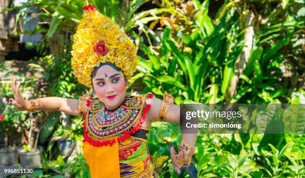 portrait of an balinese dancer dancing - denpasar stock pictures, royalty-free photos & images