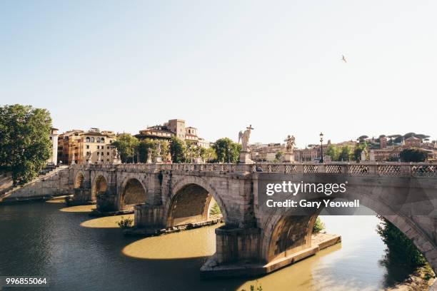 ponte sant' angelo in over tiber rome - river tiber stock pictures, royalty-free photos & images