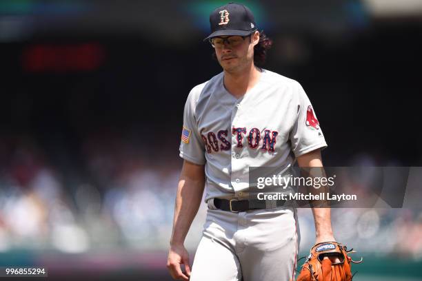 Joe Kelly of the Boston Red Sox walks back to the dug out during a baseball game against the Washington Nationals at Nationals Park on July 4, 2018...