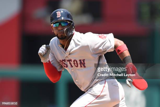 Eduardo Nunez of the Boston Red Sox leads off first base during a baseball game against the Washington Nationals at Nationals Park on July 4, 2018 in...