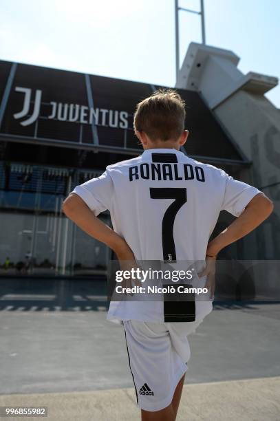 Supporter of Juventus FC poses with Cristiano Ronaldo's Juventus official jersey. Juventus FC and Real Madrid CF announced transfer of Cristiano...