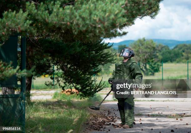 French army legionnaire attend a mine-clearing and bomb disposal exercice in Saint-Christol, southern France, on June 12, 2018.