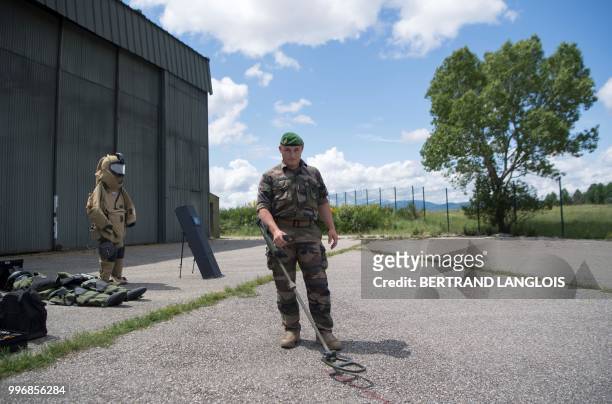 French army legionnaire attend a mine-clearing and bomb disposal exercice in Saint-Christol, southern France, on June 12, 2018.