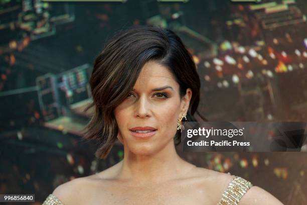 Neve Campbell wearing dress by Barney Cheng Couture attends the premiere of Skyscraper at AMC Loews Lincoln Center.