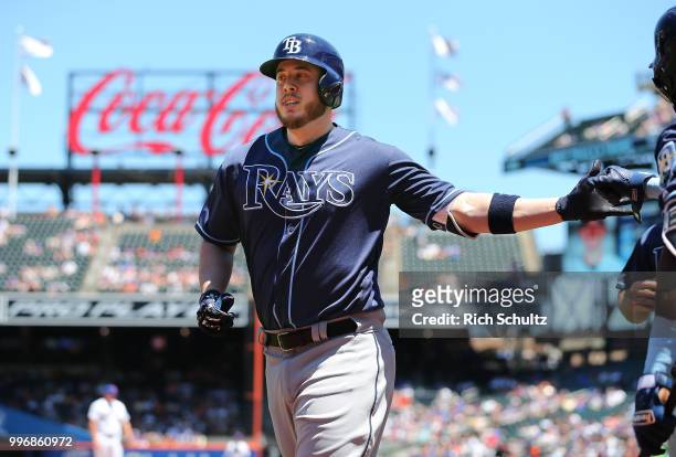Cron of the Tampa Bay Rays is congratulated after hitting a three run home run against the New York Mets during the first inning of a game at Citi...