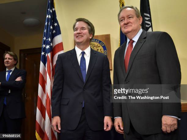 Supreme Court nominee Brett Kavanaugh, center left, poses with Sen. Michael Crapo as he visits Republicans at the US Capitol on July 2018 in...