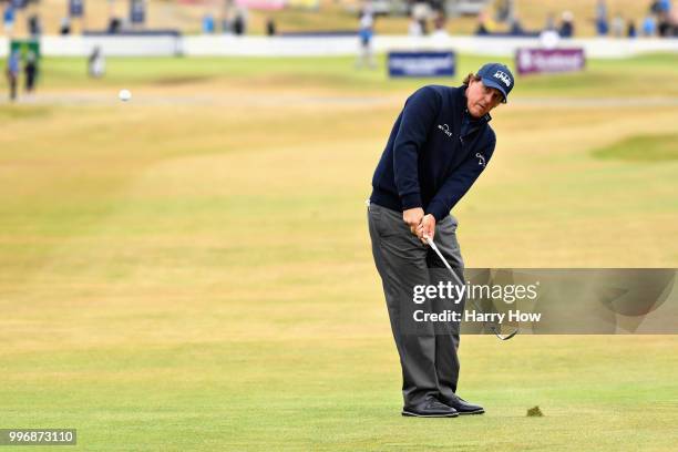 Phil Mickelson of USA takes his third shot on hole one during day one of the Aberdeen Standard Investments Scottish Open at Gullane Golf Course on...