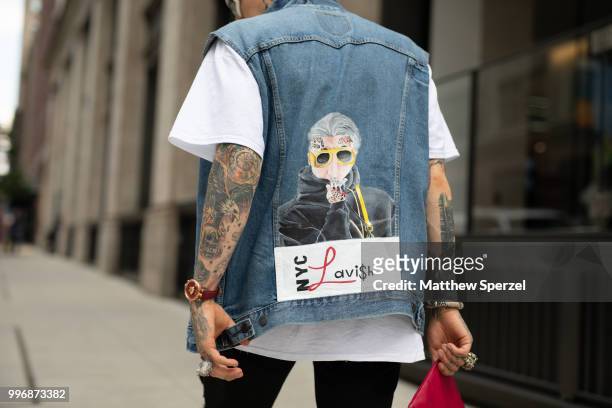 Chris Lavish is seen on the street during Men's New York Fashion Week wearing custom vest and shoes on July 11, 2018 in New York City.