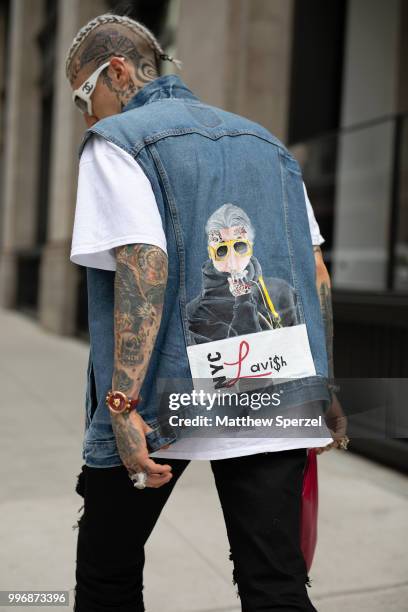 Chris Lavish is seen on the street during Men's New York Fashion Week wearing custom vest and shoes on July 11, 2018 in New York City.