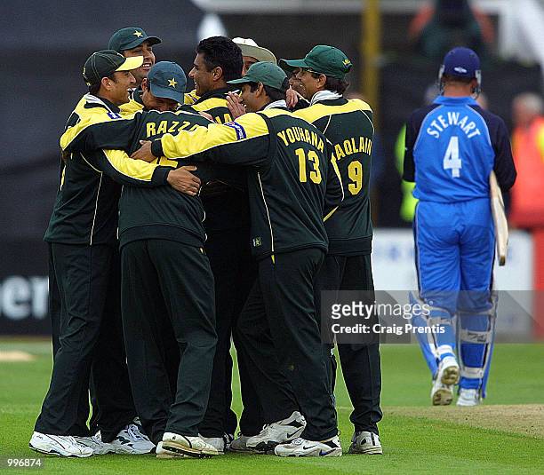 Waqar Younis of Pakistan is congratulated by his teammates after taking the wicket of Alec Stewart of England during the Natwest Series match between...