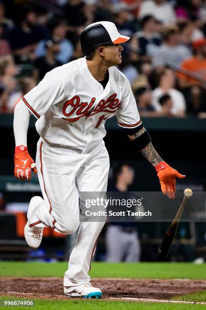 Manny Machado of the Baltimore Orioles doubles against the New York Yankees during the sixth inning at Oriole Park at Camden Yards on July 11, 2018...