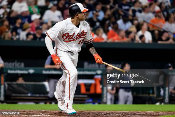 Manny Machado of the Baltimore Orioles doubles against the New York Yankees during the sixth inning at Oriole Park at Camden Yards on July 11, 2018...