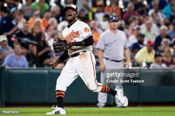 Tim Beckham of the Baltimore Orioles reacts after making an errant throw to first against the New York Yankees during the seventh inning at Oriole...