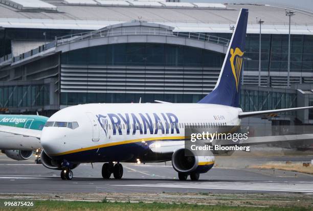 Passenger aircraft operated by Ryanair Holdings Plc taxis on the tarmac at Dublin Airport in Dublin, Ireland, on Thursday, July 12, 2018. Ryanair...