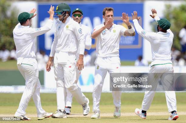 South African fast bowler Dale Steyn celebrating the wicket of Kusal Mendis with team mates during day 1 of the 1st Test match between Sri Lanka and...