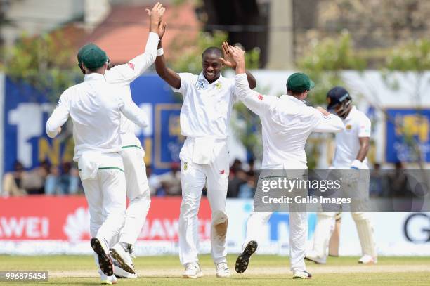 South Africa fast bowler Kagiso Rabada celebrating the wicket of Angelo Mathews with team mates during day 1 of the 1st Test match between Sri Lanka...