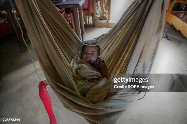 Reyang baby seen sleeping on a hammock in Kanchanpur refugee camp, 200 km far from Agartala. 35,000 people of Reang also called Bru in Kanchanpur...
