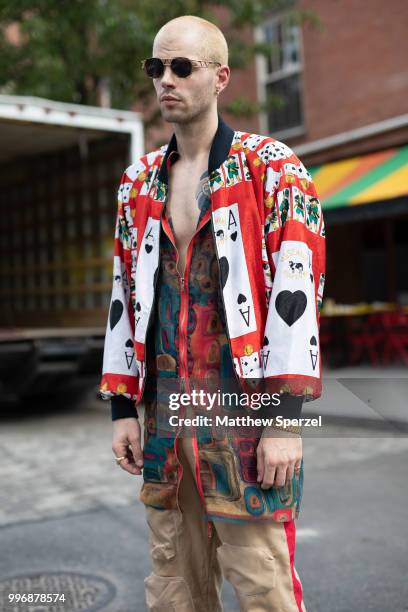 Anthony Flora is seen on the street during Men's New York Fashion Week wearing Christopher Di Giorgio with vintage Moschino jacket on July 11, 2018...