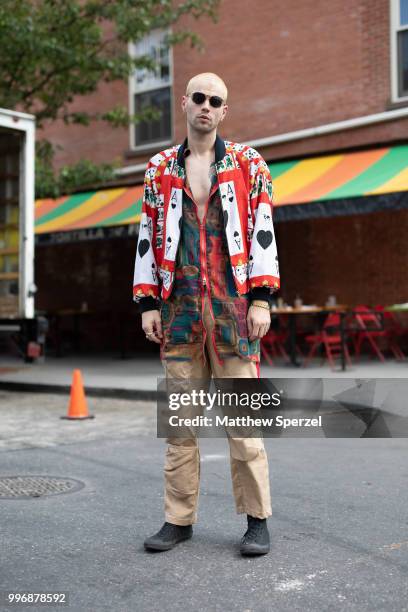 Anthony Flora is seen on the street during Men's New York Fashion Week wearing Christopher Di Giorgio with vintage Moschino jacket on July 11, 2018...