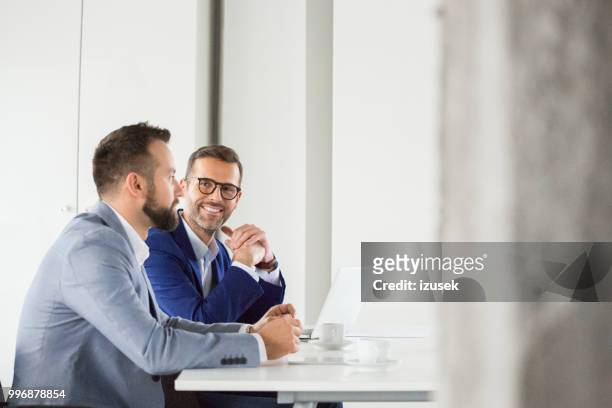 corporate professionals during meeting - izusek stock pictures, royalty-free photos & images