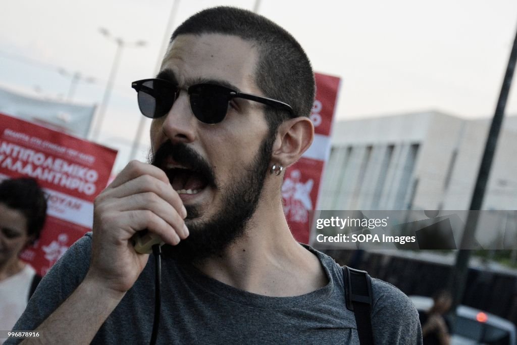 Demonstrator shouts slogans during the protest.
Hundreds of...