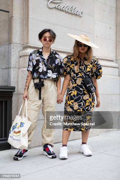 Alithea Castillo and Kim Geronimo are seen on the street during Men's New York Fashion Week on July 11, 2018 in New York City.