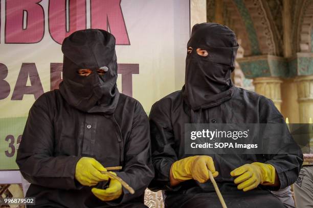 The flogging enforcers from Wilayatul Hisbah. 18 people were convicted by the Meulaboh Sharia Court of different crimes and flogged between 5 times...