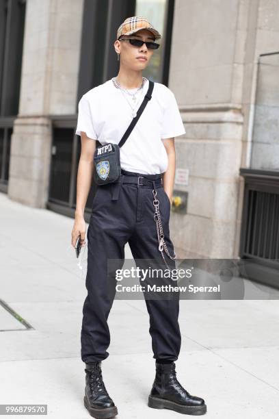 Fuji is seen on the street during Men's New York Fashion Week wearing H&M with Burberry hat on July 11, 2018 in New York City.
