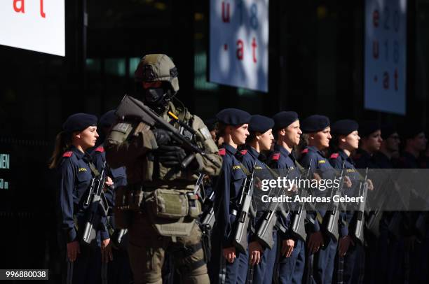 Police officers stand guard during the arrival of the ministers at the European Union member states' interior and justice ministers conference on...