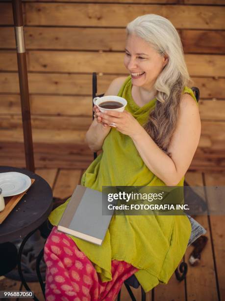 patio time with moter and son - shade45 stock pictures, royalty-free photos & images