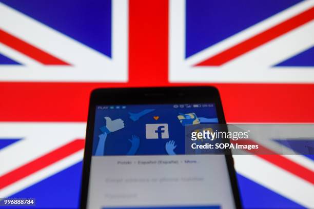 Facebook app with United Kingdom flag are seen in this photo illustration.