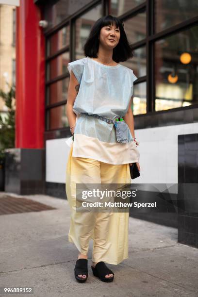 Anna Chae is seen on the street during Men's New York Fashion Week wearing Issey Miyaki on July 11, 2018 in New York City.