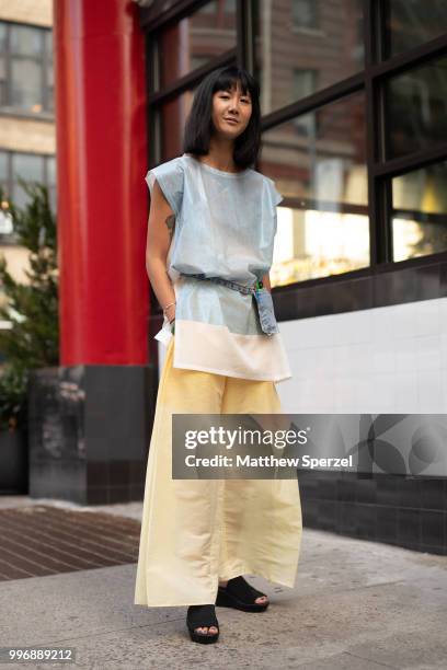 Anna Chae is seen on the street during Men's New York Fashion Week wearing Issey Miyaki on July 11, 2018 in New York City.