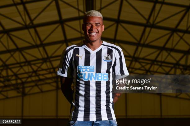 Newcastle's Kenedy poses for photos in the new home kit during a photocall at the Newcastle United Training Centre on July 9 in Newcastle upon Tyne,...