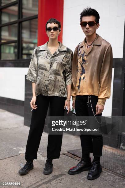 Richard Shieh and Mharie Burger are seen on the street during Men's New York Fashion Week wearing Necessity Sense, Dior, Anne Demuelemeester,...