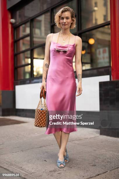 Zanita Whittington is seen on the street during Men's New York Fashion Week wearing a pink Fleur du Mal dress on July 11, 2018 in New York City.