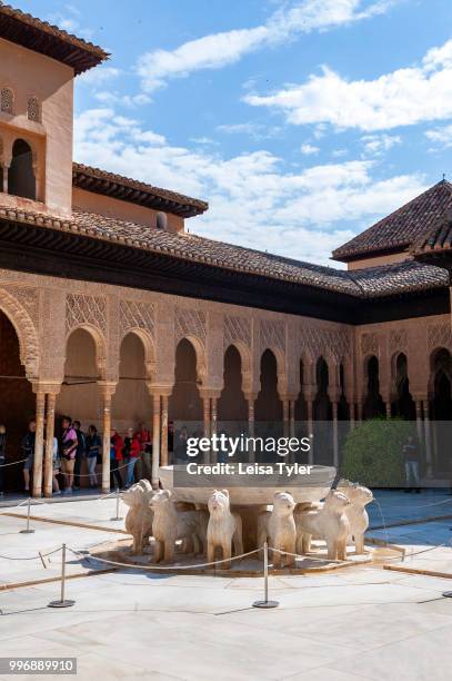 The Patio de los Leones, Courtyard of the Lions, at the Alhambra, a 13th century Moorish palace complex in Granada, Spain. Built on Roman ruins, the...