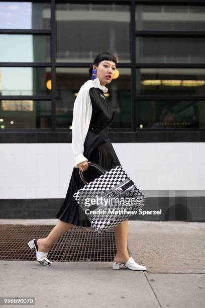 Michelle Song is seen on the street during Men's New York Fashion Week wearing Balenciaga skirt and top with Dior on July 11, 2018 in New York City.