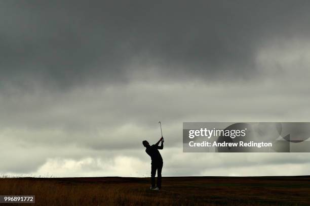 Chris Hanson of England takes his second shot on hole ten during day one of the Aberdeen Standard Investments Scottish Open at Gullane Golf Course on...