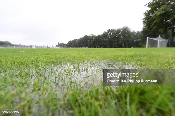 Puddle on the pitch during the training at the Schenkendorfplatz on July 12, 2018 in Berlin, Germany.