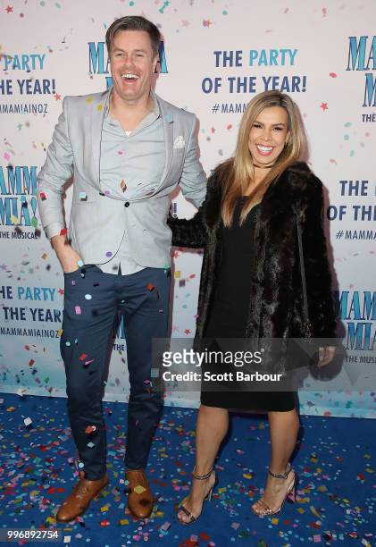 Carly Bowyer and Troy Delmege throw confetti in the air as they attend the opening night of Mamma Mia! The Musical at Princess Theatre on July 12,...