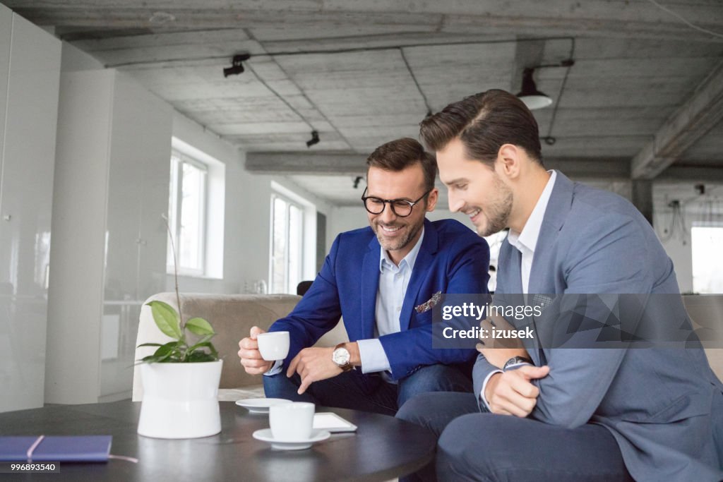 Businessman in discussion over a cup of coffee