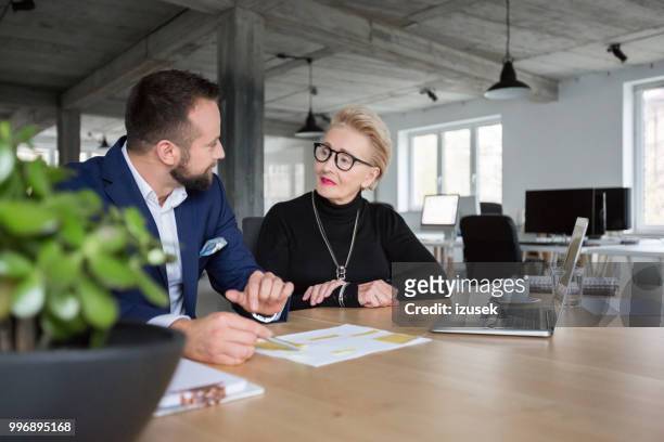 business people discussing new project - izusek stock pictures, royalty-free photos & images