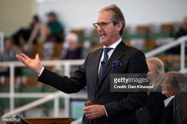Tattersalls auctioneer John O'Kelly during the 'Tattersalls' July Sale on July 11, 2018 in Newmarket, England. Founded in 1766 Tattersalls is Europes...