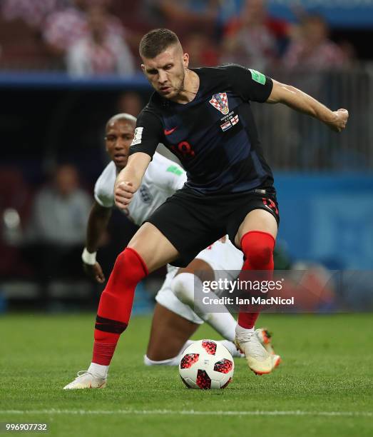 Ashley Young of England vies with Ante Rebic of Croatia during the 2018 FIFA World Cup Russia Semi Final match between England and Croatia at...